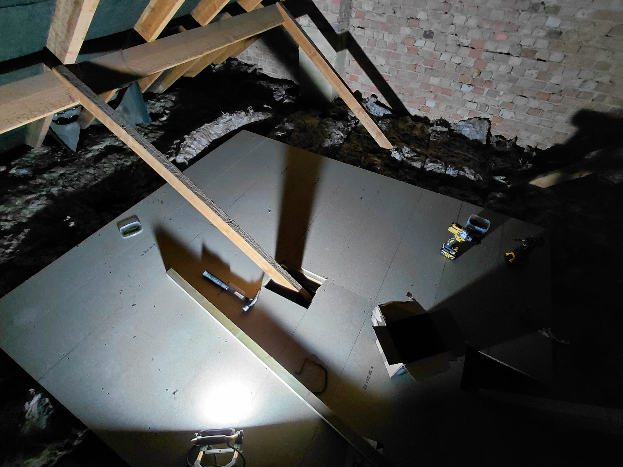 Loft boarding across attic joists