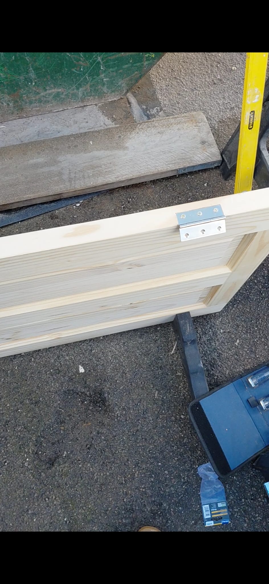 Pine door installation in progress